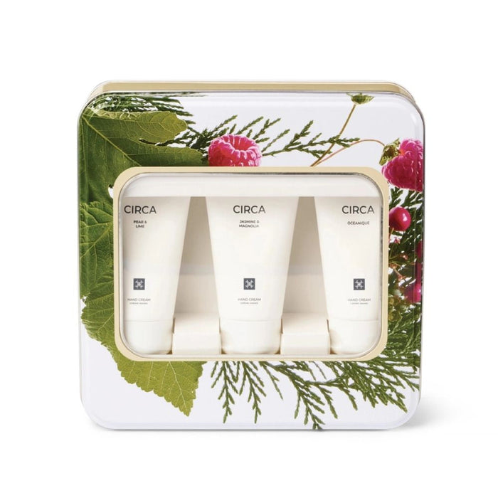 A set of three cylindrical tubes of cream, each labeled with the brand name "CIRCA" and the product type "Hand Cream". The tubes are arranged in a row, with the first one being larger than the other two. The packaging features a floral design with green leaves and pink flowers, creating a visually appealing presentation.