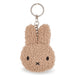 A keychain in the shape of a bunny with a fuzzy texture and a black eye and nose.