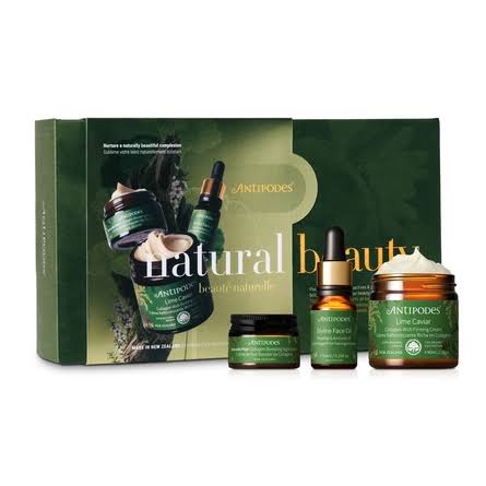 a set of natural beauty products from the brand Antipodes, including a jar, a bottle, and a tube.