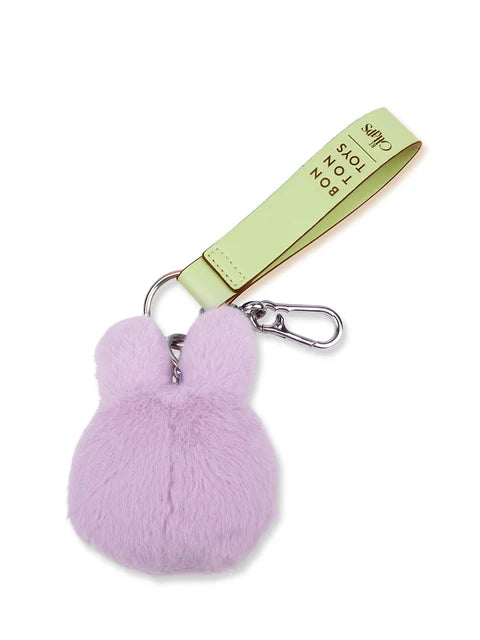 A small, plush keychain in a light purple color.