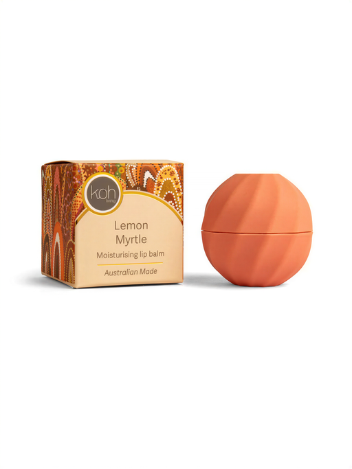 A box of Lemon Myrtle lip balm next to a round orange container, both sitting on a white background.