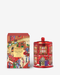 a red tin can with a Christmas-themed design next to a box with a similar design.