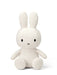 A white stuffed rabbit toy with black eyes and a black x on its face.