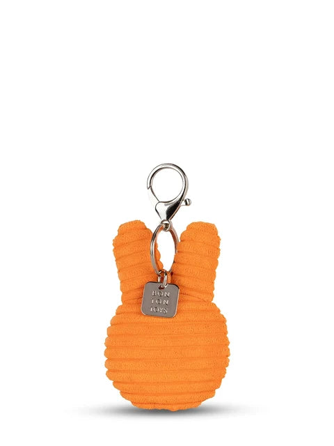 An orange, plush keychain shaped like a bunny with a metal hook attached to it.