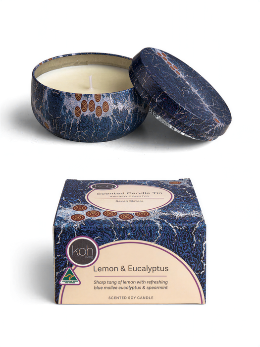 a blue and white patterned tin candle with a white candle inside, and a matching box with a similar design.