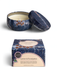 a blue and white patterned tin candle with a white candle inside, and a matching box with a similar design.