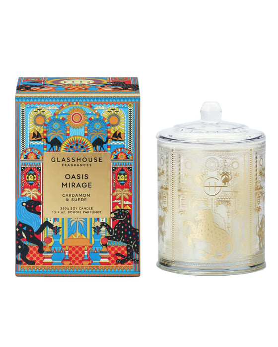 a colorful box and a glass jar with a gold and white design, both of which appear to be decorative containers.