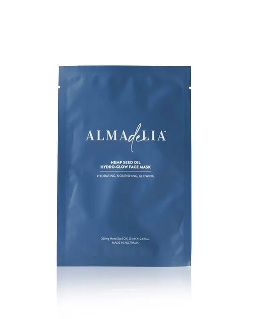 A blue package of AlmaDella's Hemp Seed Oil Hydrating, Concentrating, Glowing Face Mask.