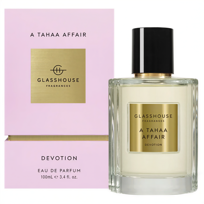 a perfume bottle and its packaging. The perfume bottle is labeled "A TAAA Affair Devotion EAU DE PARFUM 100mL e 3.4hl. 0oz." The packaging is pink and displays the text "GLASHOUSE Fragrances" and "A TAAA Affair Devotion".