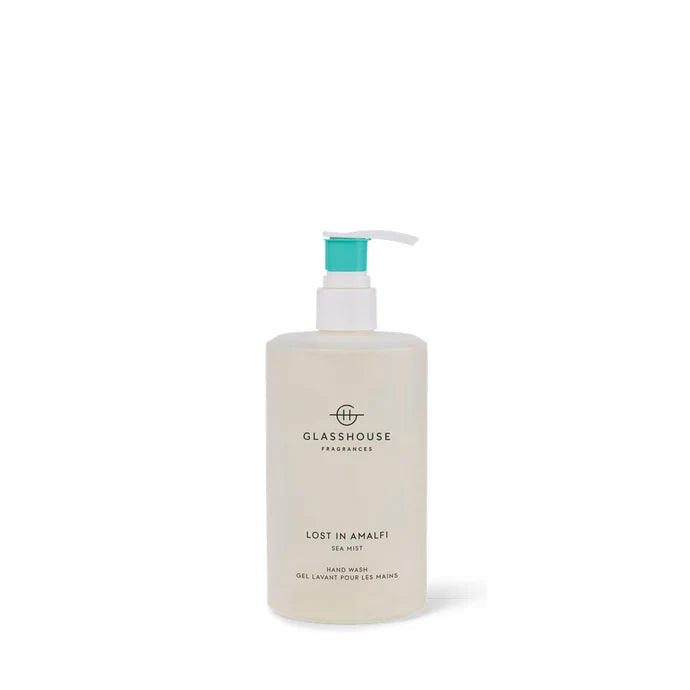 A bottle of "Lost in Amalfi Sea Mist" hand wash, with a pump dispenser and a white cap.