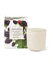 a white ceramic candle holder with a lid, placed next to a box of blackberry and plum-scented soy candles.